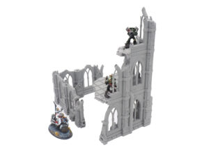 Grey 3D-printed gothic ruin miniature terrain with multiple levels, shown with sci-fi miniatures for scale