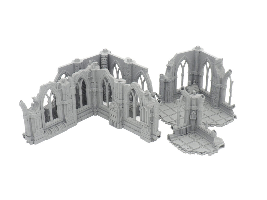 Grey unpainted 3D-printed gothic ruin miniature terrain sections for tabletop wargaming