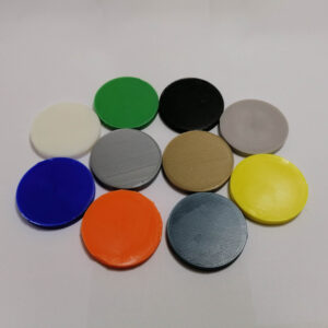 A Set of Differently Coloured Plastics Discs Showing Avilable Colours to Print in
