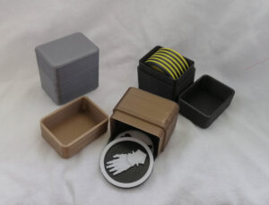 40mm Objective Marker Cases Shown in Gold, Silver, and Black