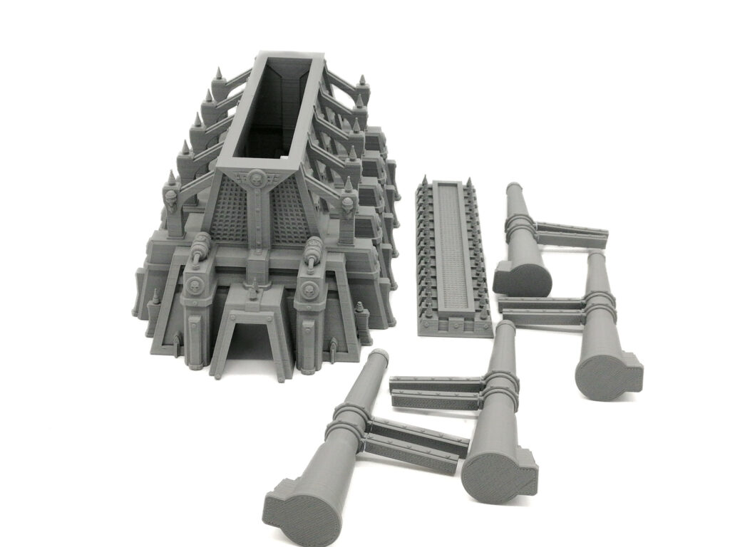 Grey 3D-printed sci-fi gothic bunker and modular pipe components for miniature tabletop gaming terrain