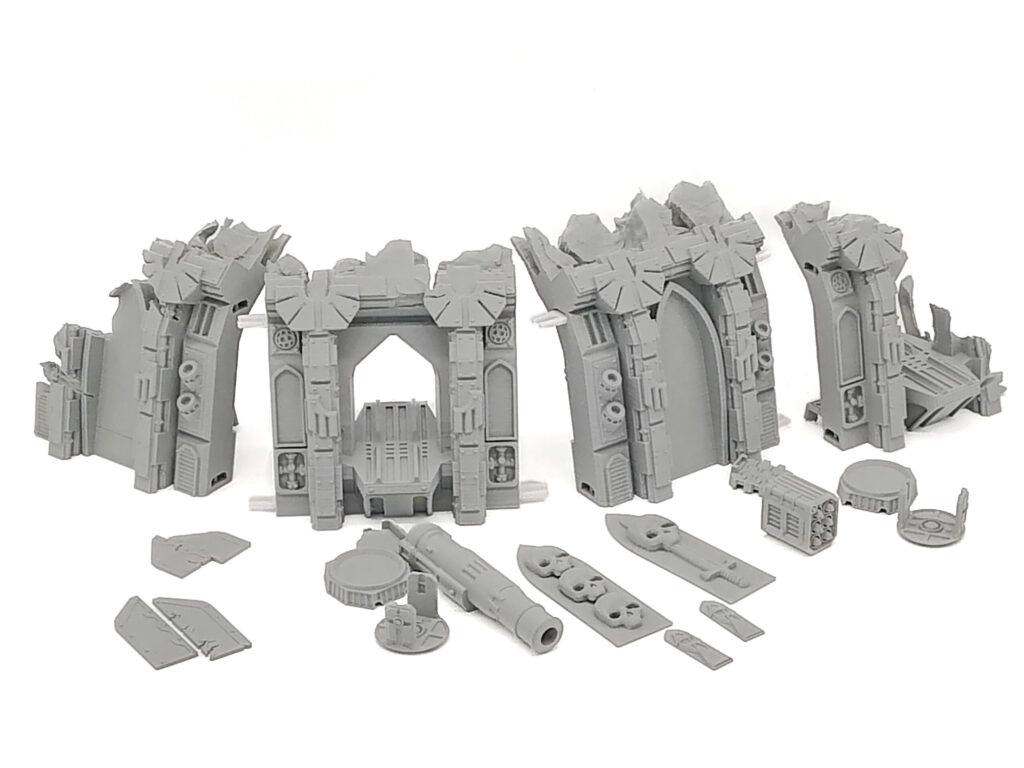 Unpainted grey 3D-printed gothic ruin terrain set and accessories for tabletop gaming