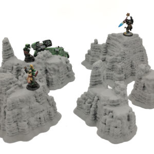 Grey 3D-printed rocky outcrop terrain pieces for tabletop wargames, shown with miniature figures for scale