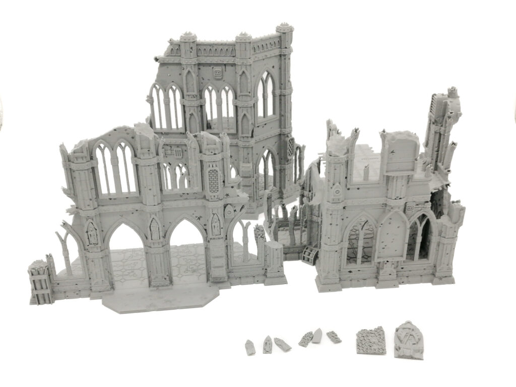 Ruined gothic building miniature terrain set, 3D-printed in grey plastic for tabletop gaming