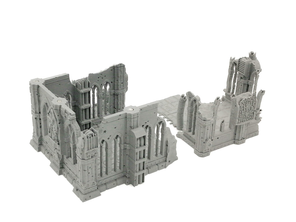 Grey 3D-printed gothic ruins miniature terrain with arched windows, designed for tabletop wargames