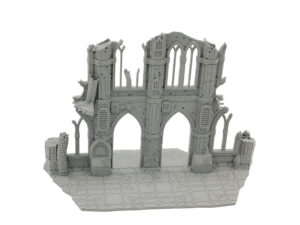 Grey 3D-printed miniature Gothic ruin terrain piece with arched doorways and windows on a tiled base