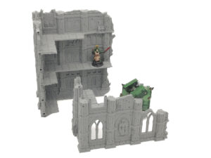 Grey 3D-printed gothic ruins terrain for tabletop wargaming, showing a multi-level building and ruined wall section