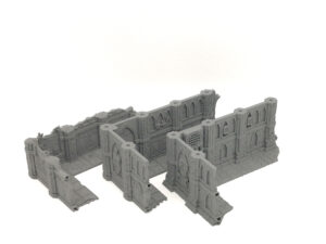 Grey 3D-printed modular gothic ruins terrain wall sections for tabletop gaming