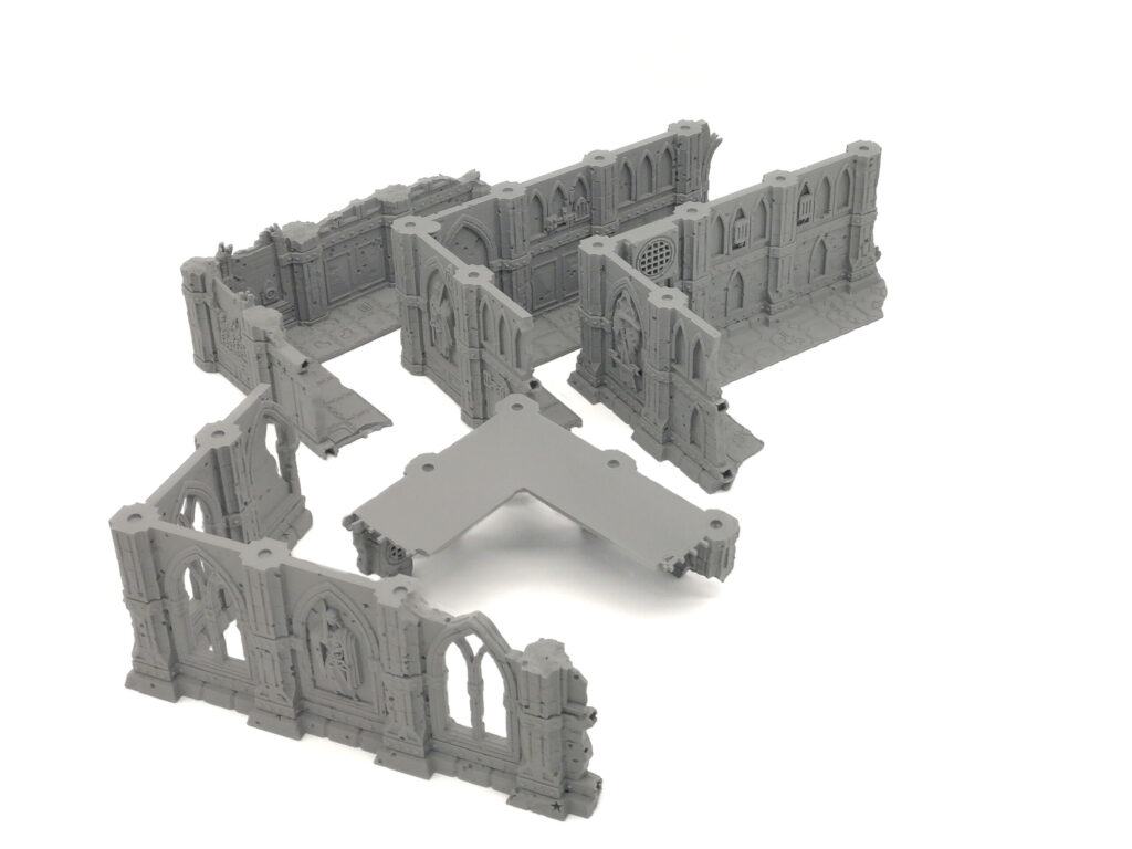 Grey modular 3D-printed Gothic ruin wall sections for tabletop miniature gaming