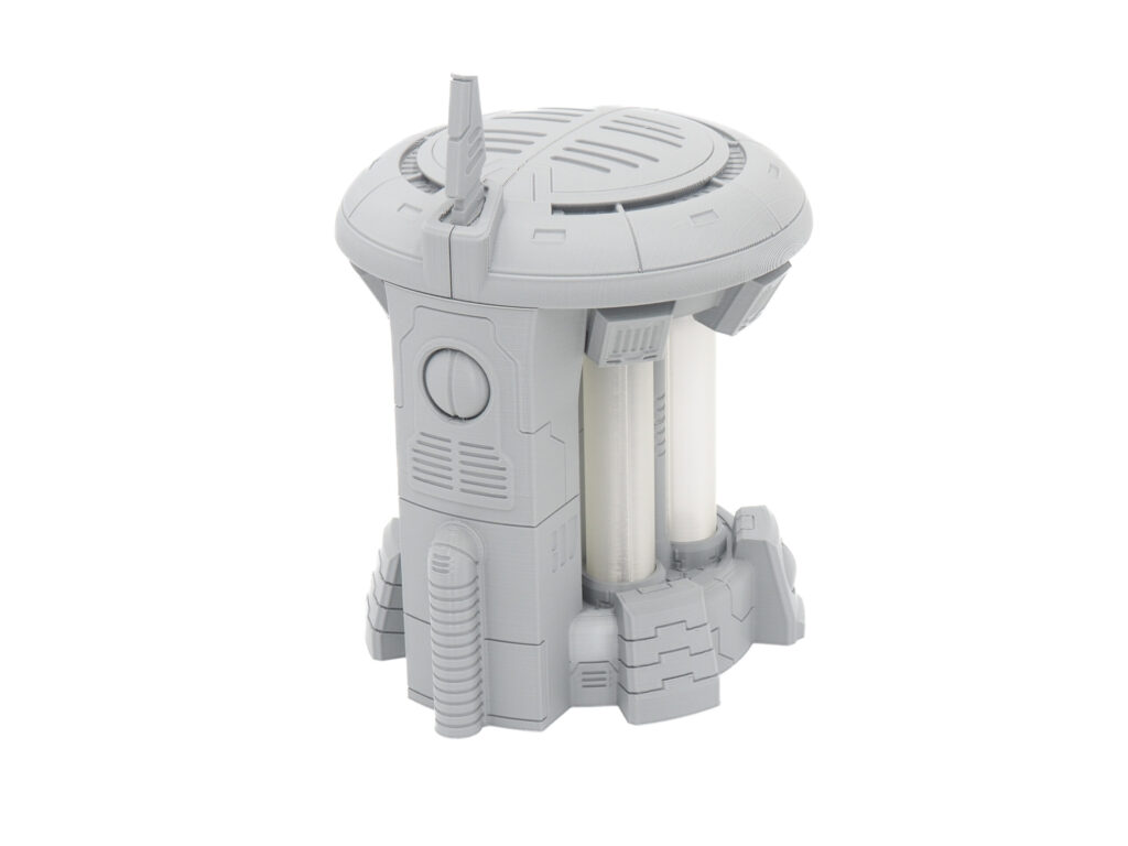 3D-printed grey sci-fi generator miniature with translucent white cylinders, shown on a white background