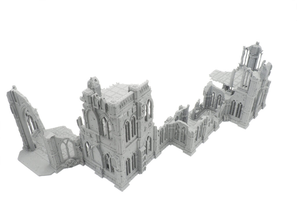 Unpainted grey 3D-printed gothic cathedral ruins miniature terrain for tabletop wargaming