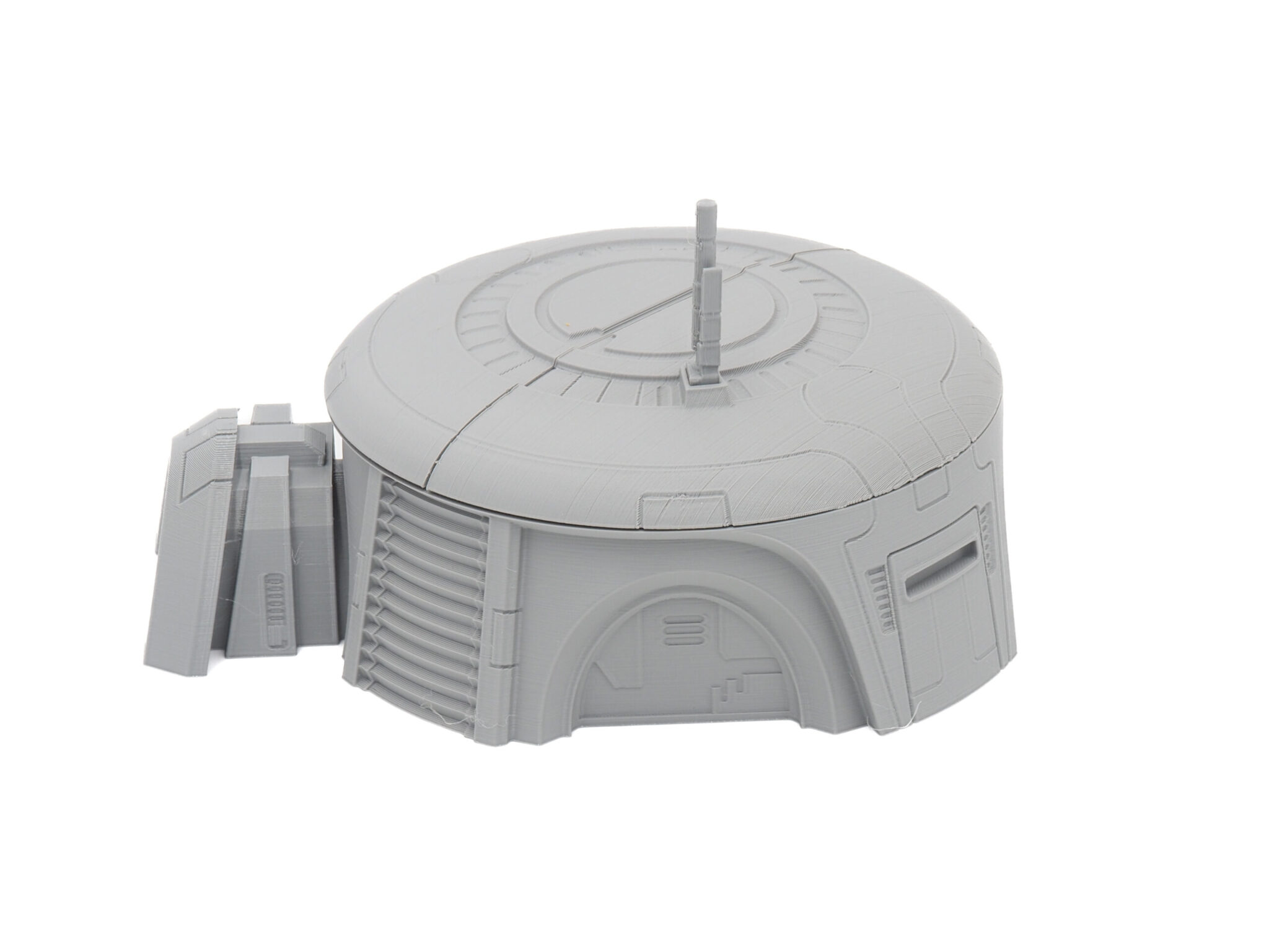 Grey 3D-printed sci-fi bunker miniature with a circular domed roof and antenna, on a white background