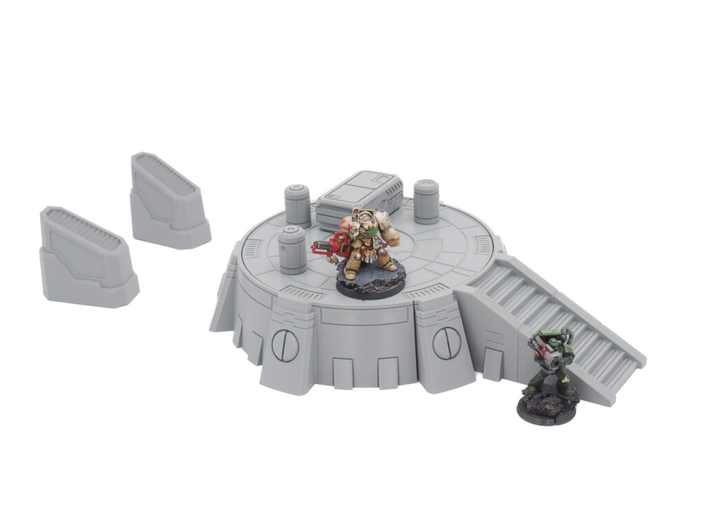 Grey 3D-printed sci-fi circular platform and stairs tabletop wargaming terrain, shown with miniature figures