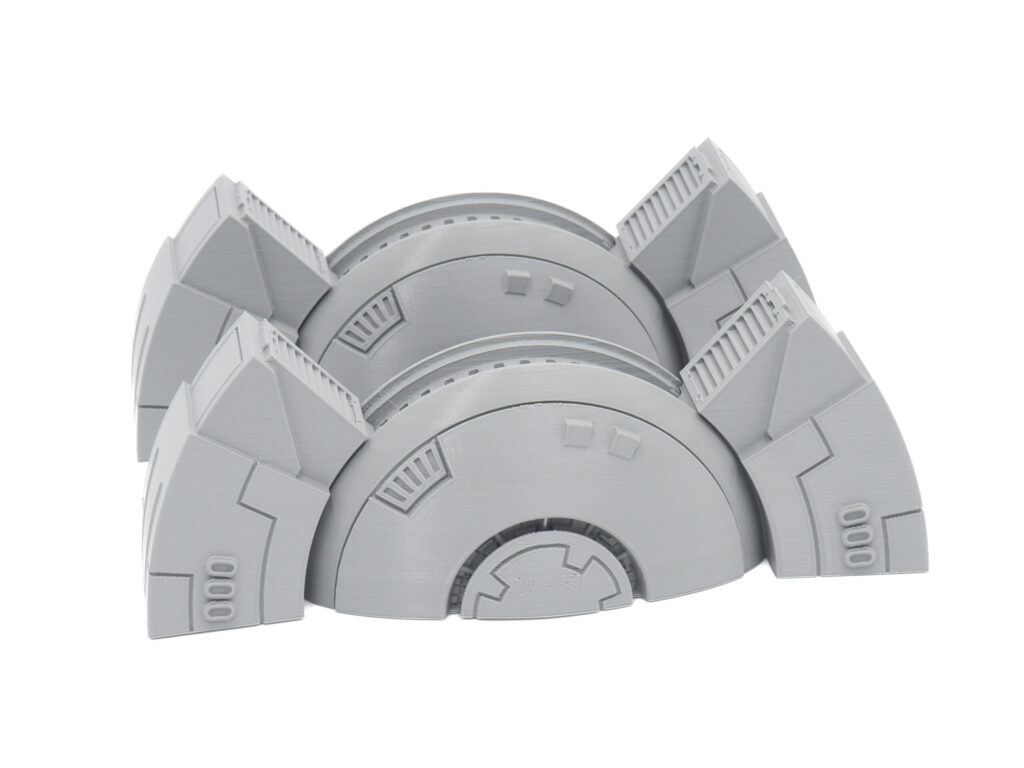 Grey 3D-printed sci-fi tabletop terrain piece with semi-circular archways and panel details
