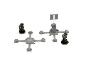 Grey 3D-printed sci-fi tabletop terrain pieces shown alongside painted miniature soldiers for scale