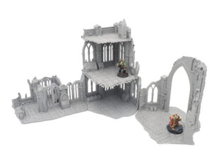 Grey 3D printed gothic ruins tabletop terrain set, shown with two painted miniature figures for scale