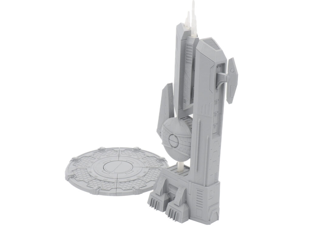 Unpainted grey 3D-printed sci-fi miniature scenery featuring a futuristic tower and a circular platform
