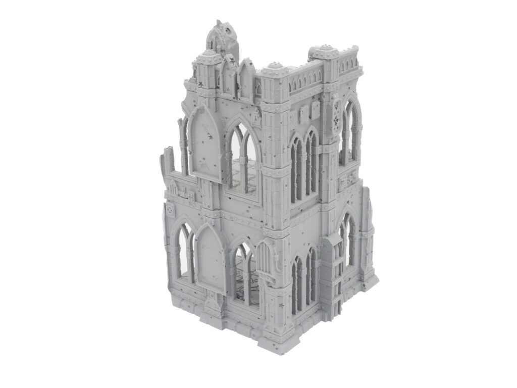 Unpainted grey 3D-printed miniature of ruined gothic building terrain for tabletop gaming