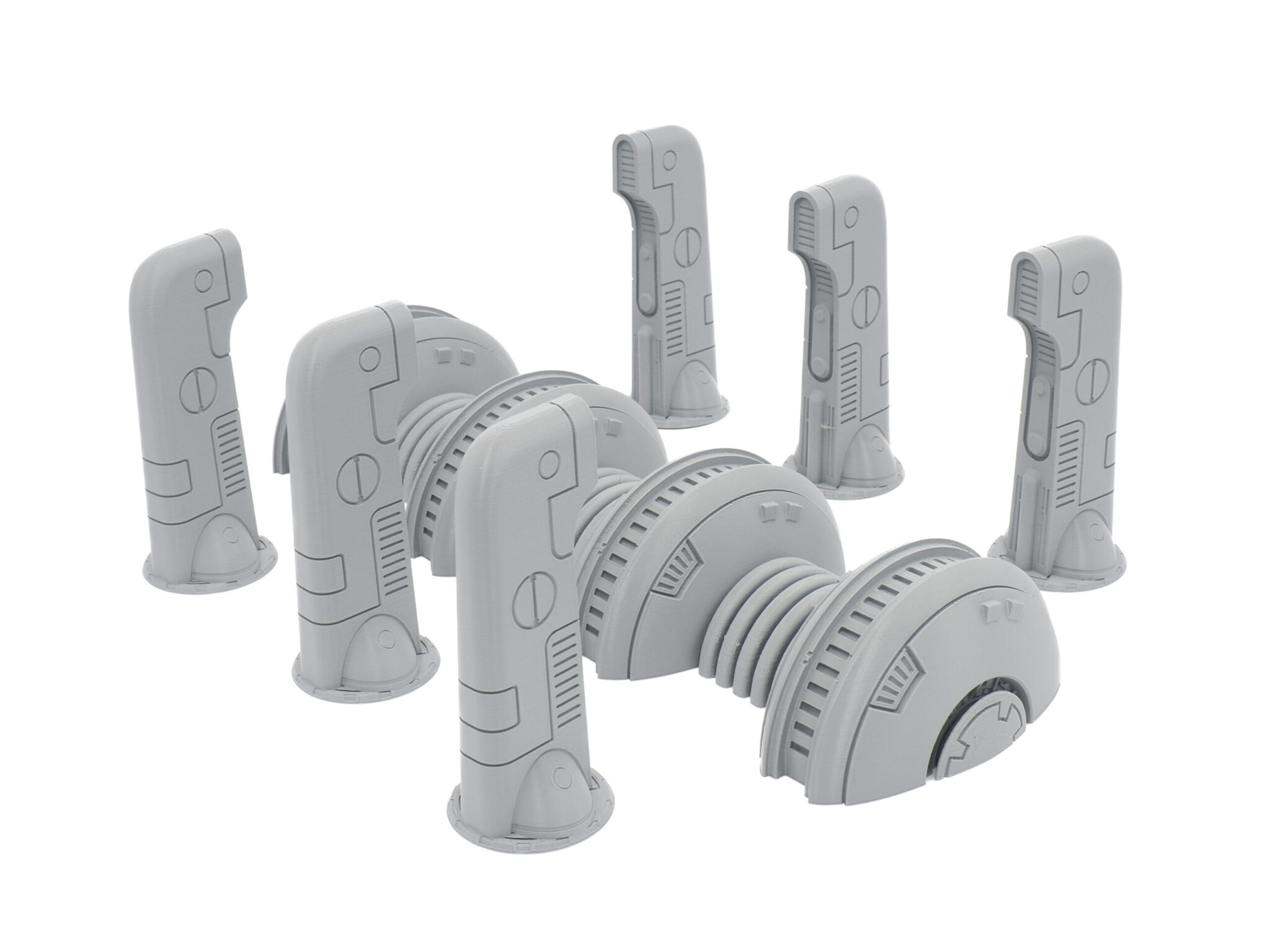 Unpainted grey 3D-printed sci-fi tabletop terrain set featuring a central generator conduit and five control pylons