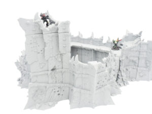 Grey 3D-printed tabletop wargaming fortress wall terrain with spikes, shown with miniature figures for scale