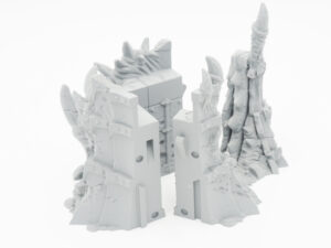 Grey 3D-printed fantasy ruins and spire miniatures for tabletop gaming