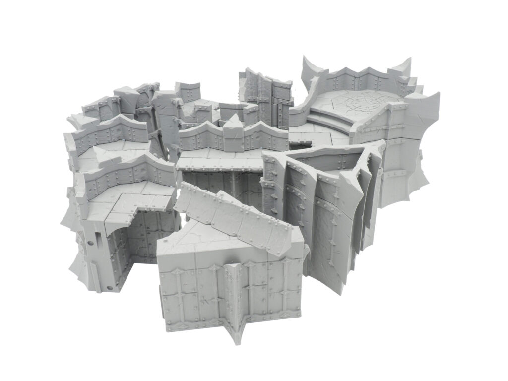 Grey 3D-printed modular gothic fortification terrain pieces for tabletop gaming, arranged on a white background