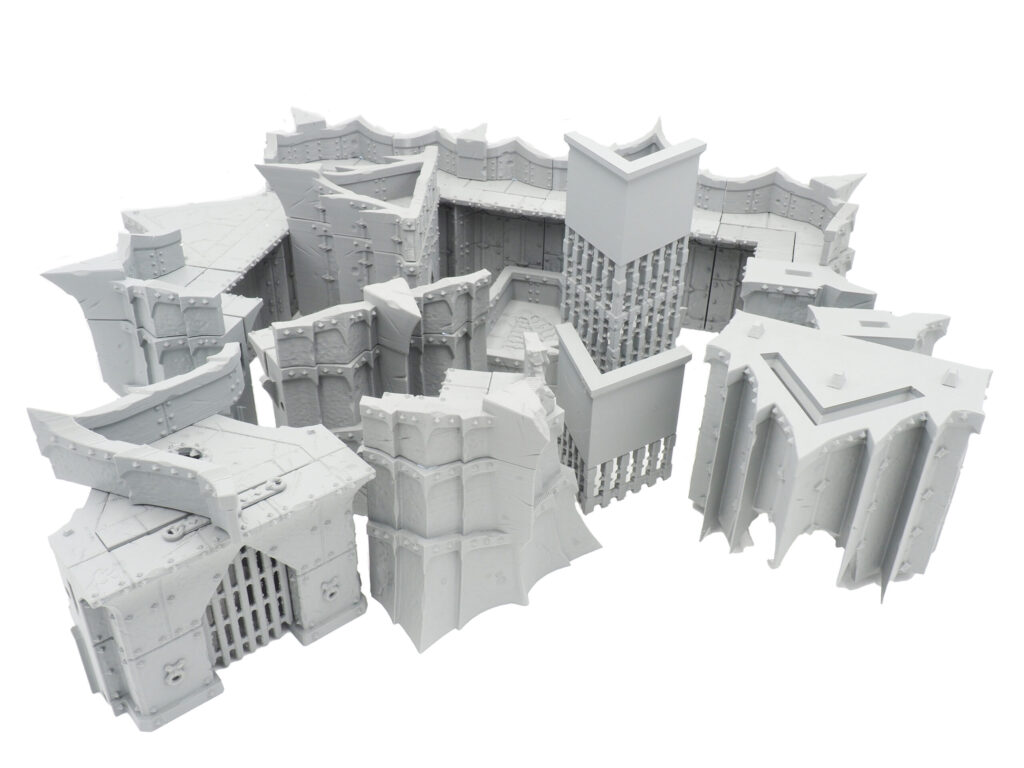 Modular grey 3D-printed fantasy fortress terrain pieces for tabletop gaming, shown on a white background