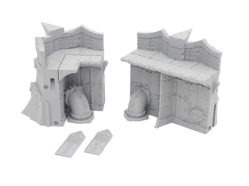 Grey 3D-printed miniature sci-fi industrial wall terrain sections with pipes for tabletop wargaming