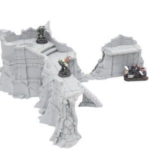 Grey 3D-printed ruined fortress wall terrain for tabletop wargaming, shown with miniature figures for scale