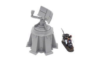 Grey 3D-printed sci-fi radar tower model next to a painted gaming miniature for scale on a white background