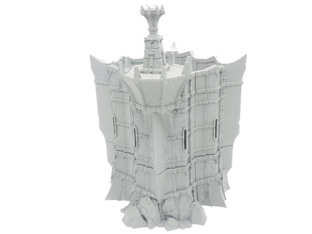 Grey 3D-printed miniature fantasy fortress wall and tower with spiked battlements for tabletop gaming