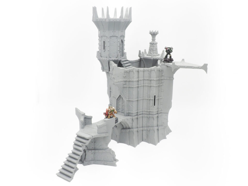 Grey 3D-printed gothic fantasy tower terrain for tabletop gaming, shown with miniatures on a plain white background