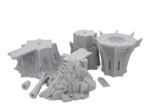 Grey 3D printed tabletop miniature terrain pieces, including Gothic pillars and a rocky outcrop, on a white background
