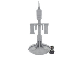 Grey 3D-printed sci-fi tower terrain with banners, pictured next to a small tabletop miniature for scale