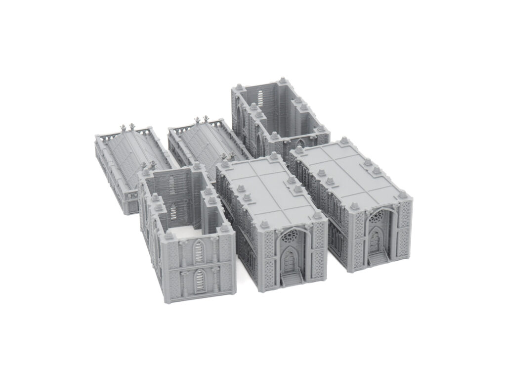 Unpainted grey 3D-printed modular Gothic terrain pieces for tabletop wargaming, arranged on a white background