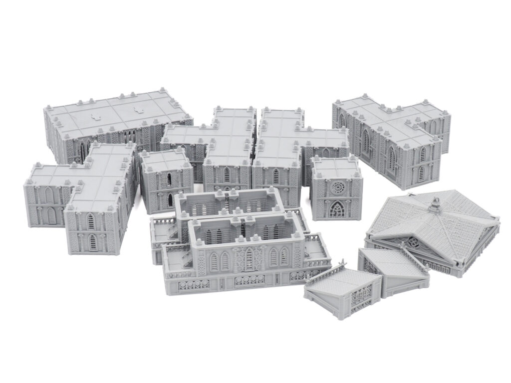 Grey 3D-printed modular gothic building terrain pieces for tabletop gaming, arranged on a white background