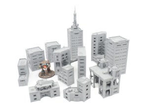 Grey 3D-printed sci-fi miniature buildings for tabletop gaming, shown with a painted mech figure for scale