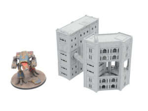 Grey 3D-printed sci-fi buildings connected by a walkway, shown next to a painted miniature mech for scale