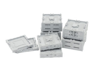 Grey 3D-printed modular sci-fi terrain blocks and panels on a white background