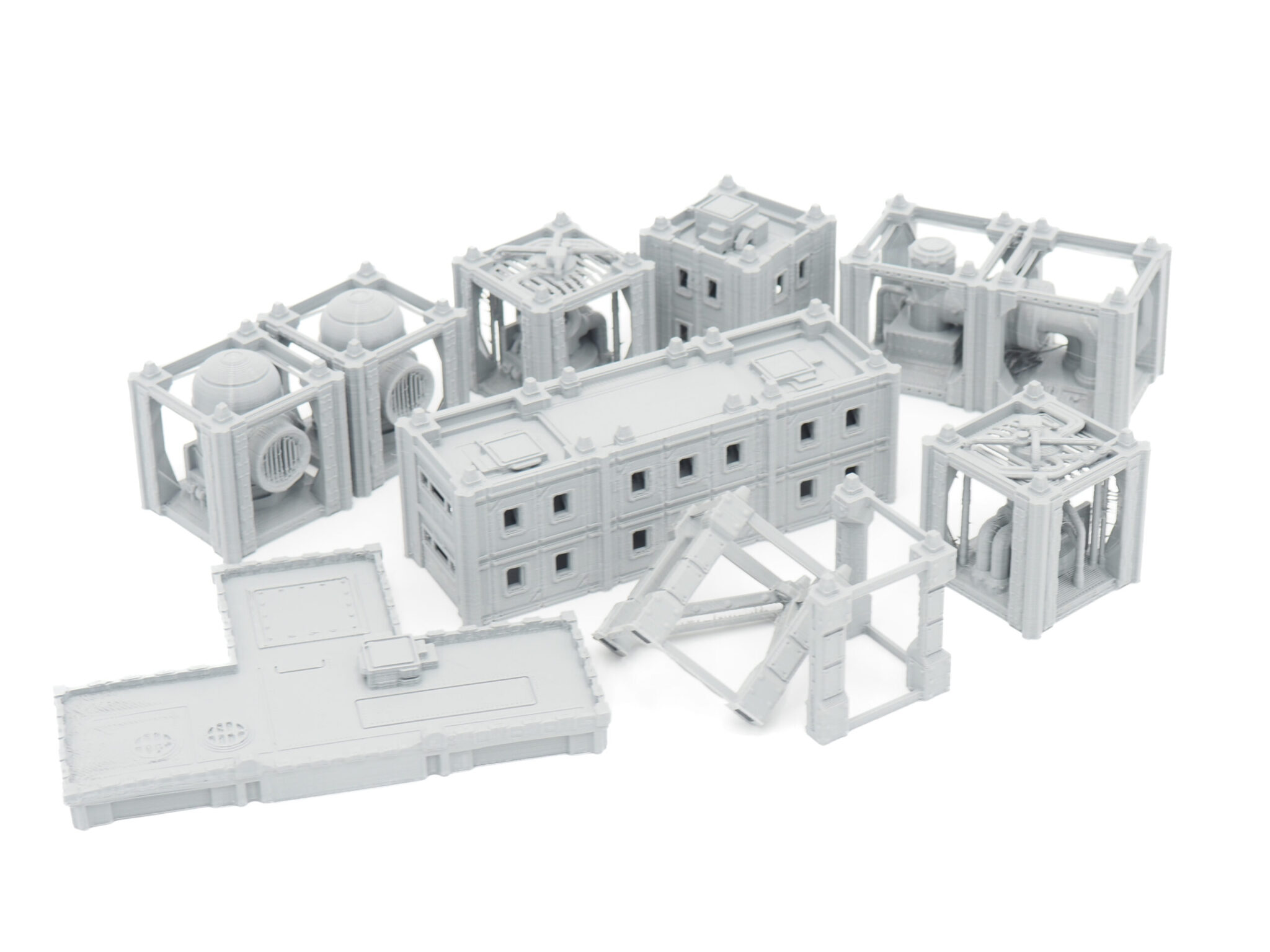 Modular grey 3D-printed miniature industrial structures and walkways for tabletop sci-fi gaming