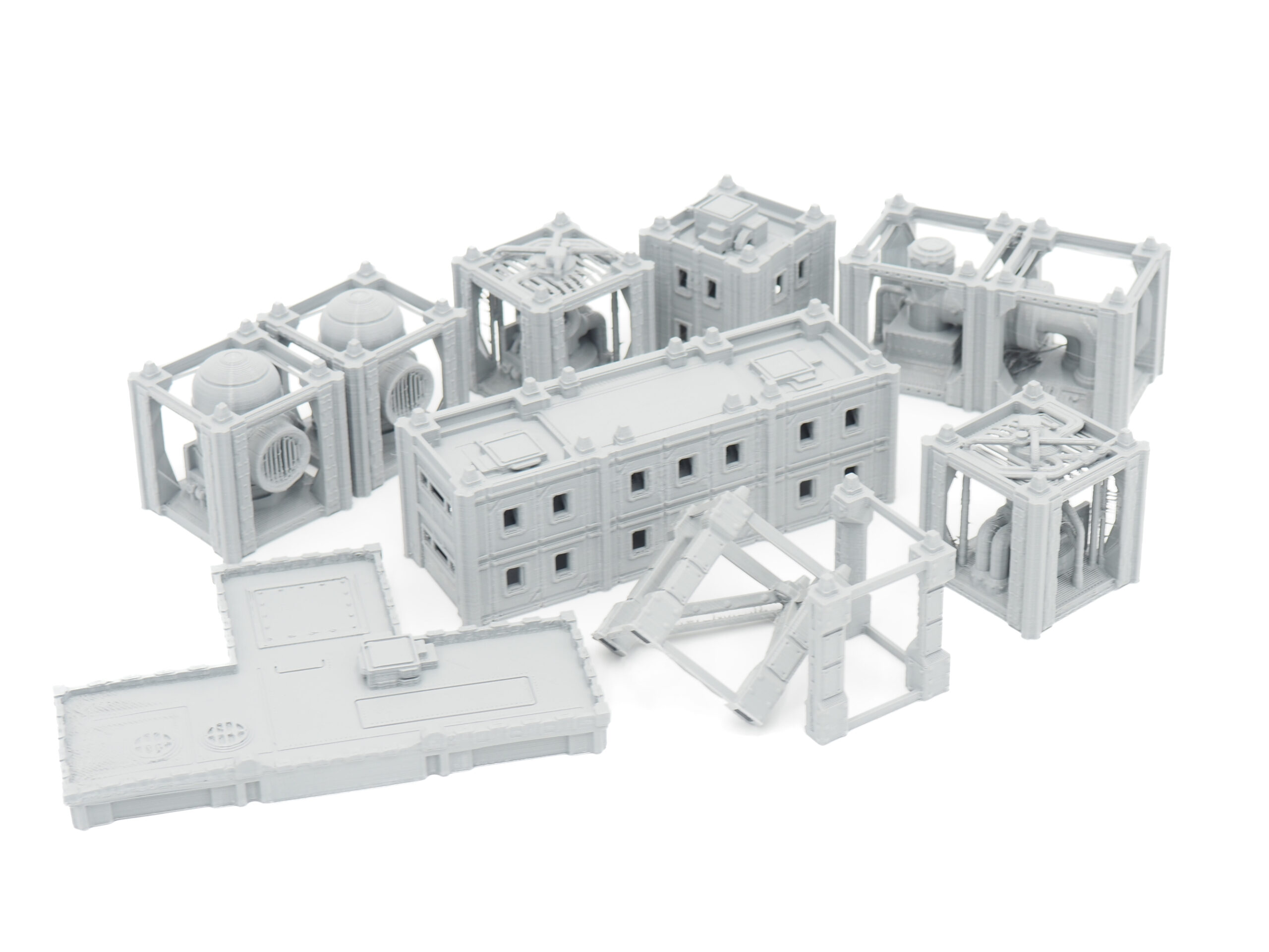 Modular grey 3D-printed miniature industrial structures and walkways for tabletop sci-fi gaming