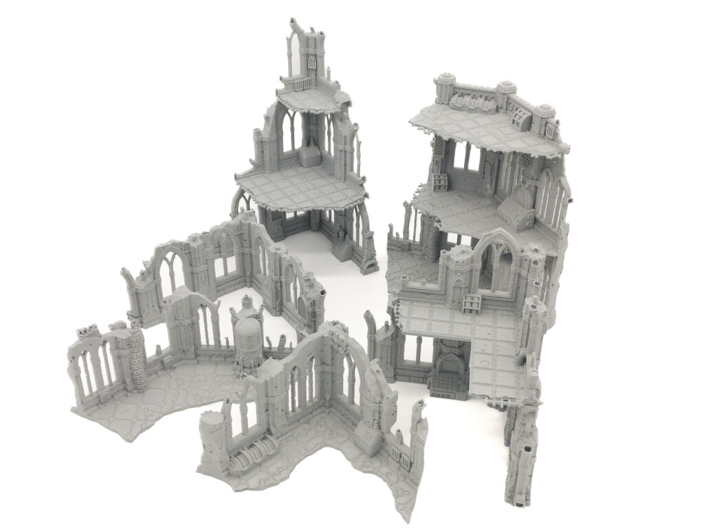 Grey 3D-printed gothic ruin miniature terrain set with multi-level buildings for tabletop wargaming