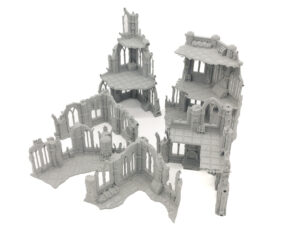 Grey 3D-printed gothic ruin miniature terrain set with multi-level buildings for tabletop wargaming