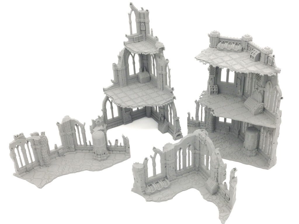 Grey 3D-printed gothic ruin terrain pieces for tabletop miniature gaming