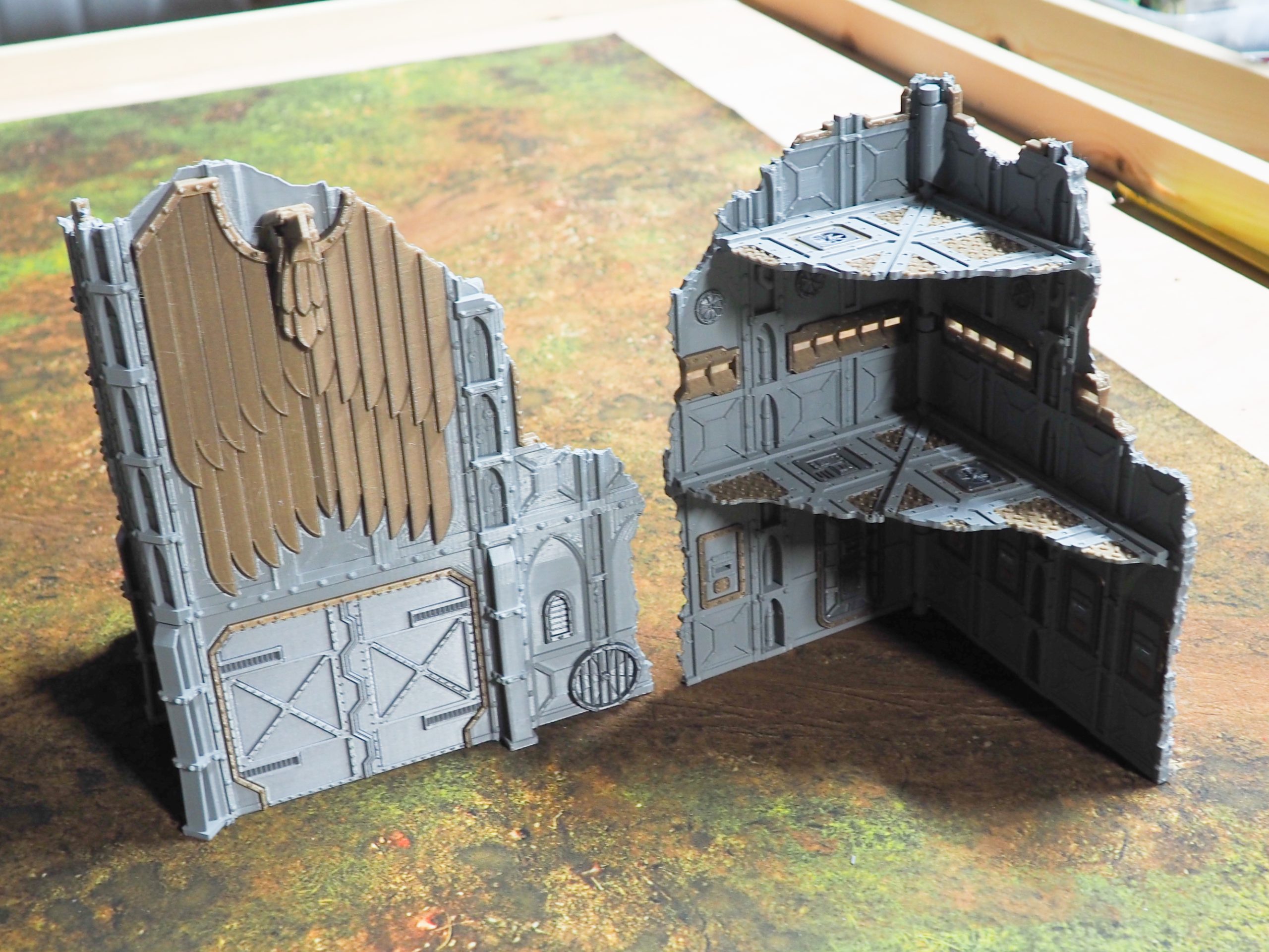 Two 3D-printed grey and bronze gothic ruined building terrain pieces for tabletop gaming