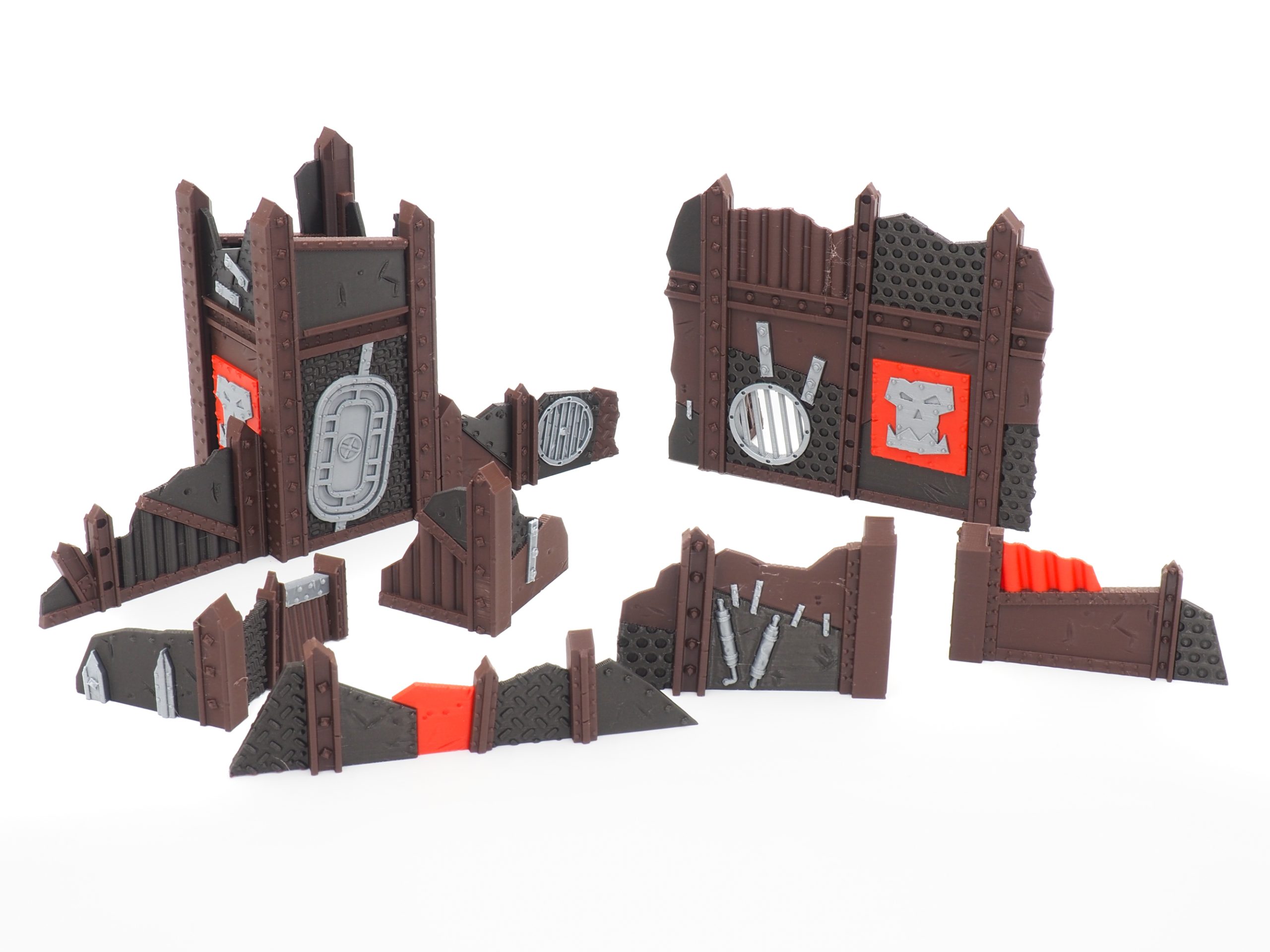 Modular 3D-printed sci-fi orc terrain set with a fortified tower, defensive walls, and scrap barricades