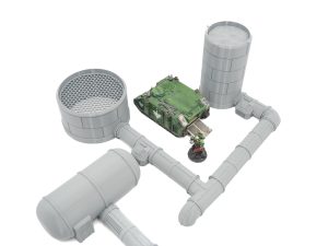 Grey 3D-printed industrial terrain set with pipes and storage tanks, shown with miniatures for scale